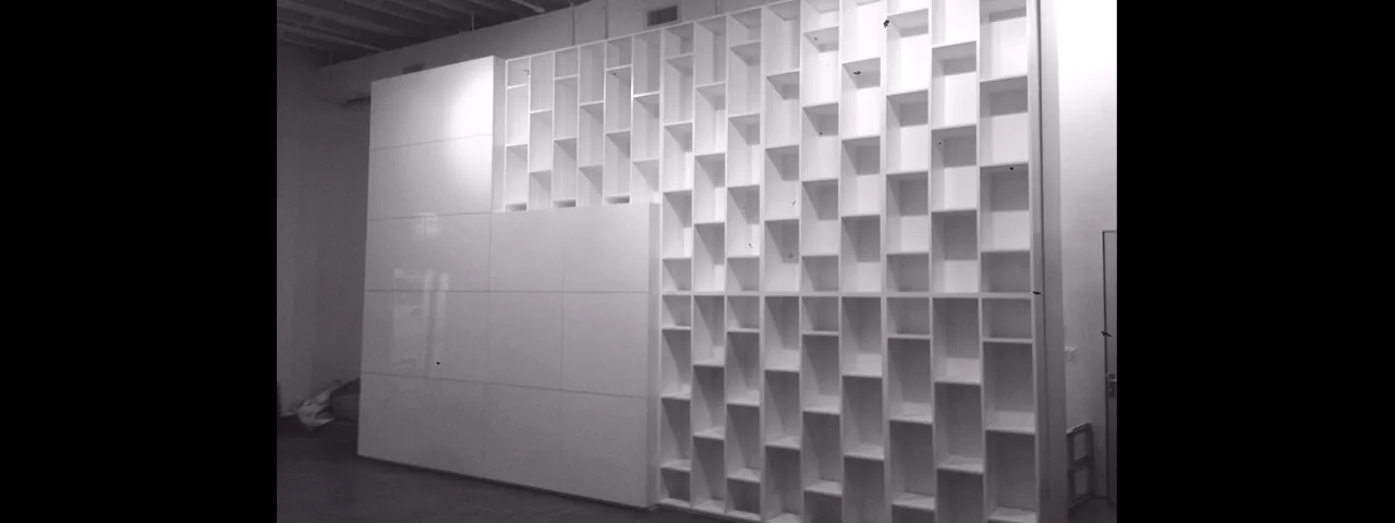 Sculptural custom white wall cabinetry by Alancraft